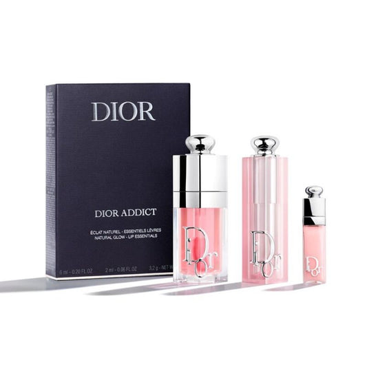Dior Addict lip products including lip balm and lip gloss with packaging on a white background